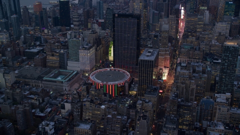 AX121_084.0000063F - Aerial stock photo of Madison Square Garden at sunset in Midtown Manhattan, New York City