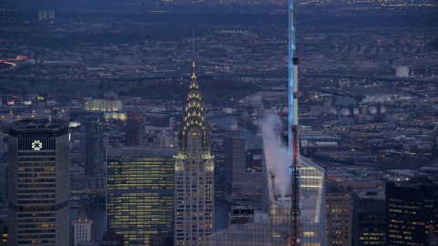 AX121_089.0000311F - Aerial stock photo of The Chrysler Building at sunset in Midtown Manhattan, New York City