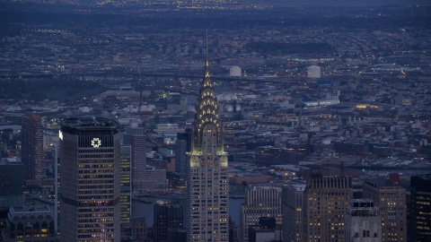 AX121_090.0000279F - Aerial stock photo of The tops of the MetLife and Chrysler Building in Midtown at sunset in New York City