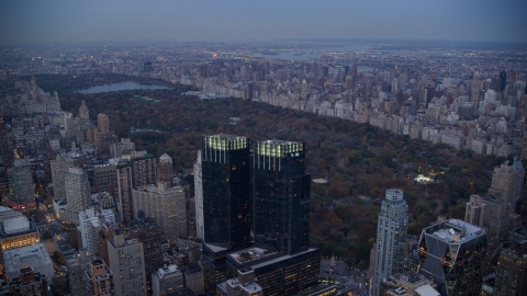 AX121_091.0000268F - Aerial stock photo of Time Warner Center towers and Central Park at sunset in New York City