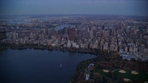 AX121_096.0000100F - Aerial stock photo of Upper East Side apartment buildings near Central Park at sunset, New York City