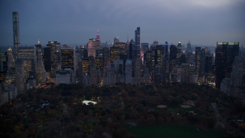 Midtown Manhattan skyscrapers on the edge of Central Park at sunset in New York City Aerial Stock Photos | AX121_100.0000107F