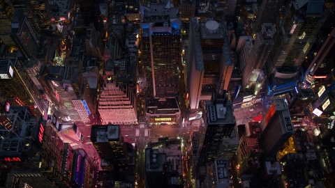 AX121_107.0000048F - Aerial stock photo of Looking down on Times Square at Sunset in Midtown Manhattan, New York City