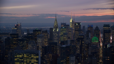 AX121_117.0000133F - Aerial stock photo of The Chrysler Building and Midtown high-rises at sunset in New York City