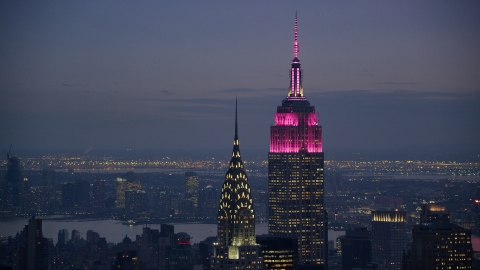 AX121_121.0000242F - Aerial stock photo of The Chrysler Building and Empire State Building at sunset, Midtown Manhattan, New York City