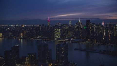 The UN Building and Midtown seen from Queens at night in New York City Aerial Stock Photos | AX121_143.0000082F