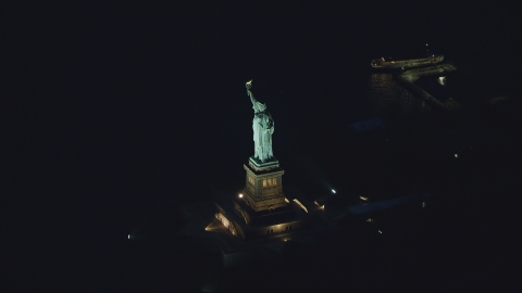 The Statue of Liberty at night in New York Aerial Stock Photos | AX121_167.0000184F