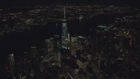 AX121_187.0000085F - Aerial stock photo of World Trade Center skyscrapers at night in Lower Manhattan, New York City