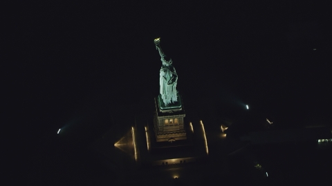 The side of the Statue of Liberty at night in New York Aerial Stock Photos | AX121_195.0000229F