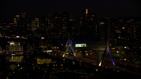 AX141_073.0000126 - Aerial stock photo of Zakim Bridge, TD Garden arena, Avalon North Station and Downtown Boston skyline, Massachusetts, night