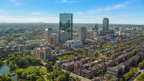 AX142_200.0000252 - Aerial stock photo of Towering skyscrapers and city buildings in Downtown Boston, Massachusetts