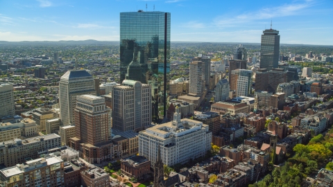 AX142_201.0000209 - Aerial stock photo of Towering skyscrapers and city buildings in Downtown Boston, Massachusetts