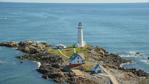 AX142_262.0000143 - Aerial stock photo of Boston Light by Boston Harbor, Little Brewster Island, Massachusetts