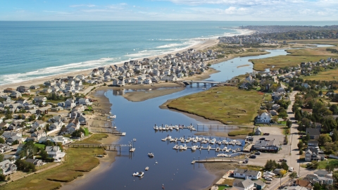 A small community on the coast beside Broad Creek and a small bridge, Humarock, Massachusetts Aerial Stock Photos | AX143_051.0000349