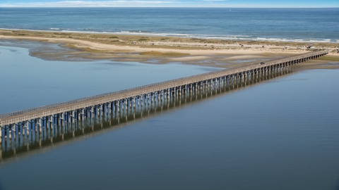 AX143_079.0000000 - Aerial stock photo of The Powder Point Bridge beside a beach, Duxbury, Massachusetts