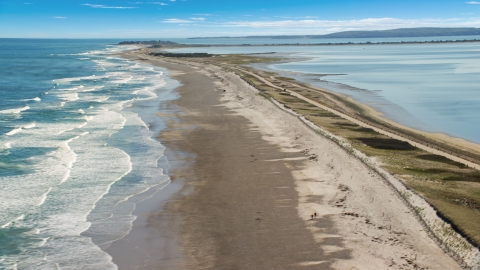 AX143_081.0000070 - Aerial stock photo of Waves rolling in on a beach, Duxbury, Massachusetts