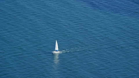 AX143_125.0000000 - Aerial stock photo of A sailing boat on Cape Cod Bay, Massachusetts