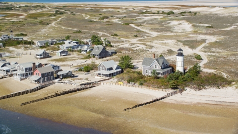 Sandy Neck Colony homes beside Sandy Neck Light, Cape Cod, Barnstable, Massachusetts Aerial Stock Photos | AX143_145.0000000