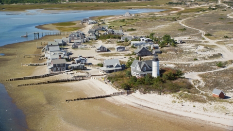 Beachfront houses at Sandy Neck Colony by Sandy Neck Light, Cape Cod, Barnstable, Massachusetts Aerial Stock Photos | AX143_145.0000207