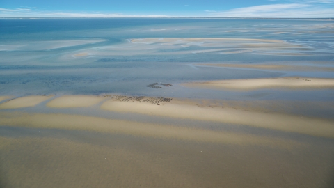 AX143_171.0000000 - Aerial stock photo of Oyster farming on sand bars at low tide, Cape Cod, Dennis, Massachusetts