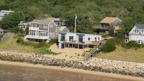 AX143_185.0000291 - Aerial stock photo of Raised beachfront homes on Cape Cod, Eastham, Massachusetts