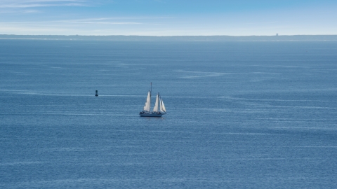 A sailing boat in Cape Cod Bay, Massachusetts Aerial Stock Photos | AX143_220.0000000