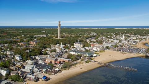 AX143_226.0000024 - Aerial stock photo of The Pilgrim Monument in a small coastal town, Provincetown, Massachusetts