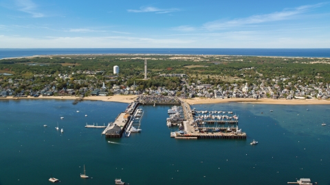 Boats docked at piers by a small coastal town, Cape Cod, Provincetown, Massachusetts Aerial Stock Photos | AX143_233.0000122