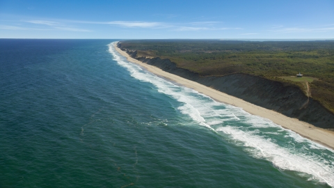 AX144_017.0000000 - Aerial stock photo of Waves crashing onto a long strip of beach,Truro, Massachusetts