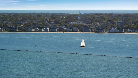 A small island town, sailboats on water, Nantucket, Massachusetts Aerial Stock Photos | AX144_074.0000000