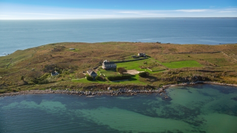 AX144_180.0000219 - Aerial stock photo of A view of Penikese Island School on Penikese Island, Elisabeth Islands, Massachusetts