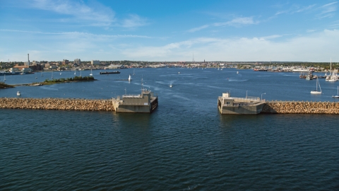 AX144_191.0000011 - Aerial stock photo of Palmer Island Light and the harbor in New Bedford, Massachusetts