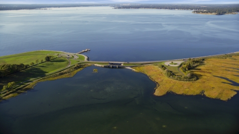 AX145_014.0000067 - Aerial stock photo of A small bridge beside a bay in Bristol, Rhode Island