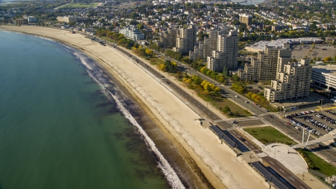 AX147_014.0000346 - Aerial stock photo of Condominium complexes beside a sandy beach, Revere, Massachusetts