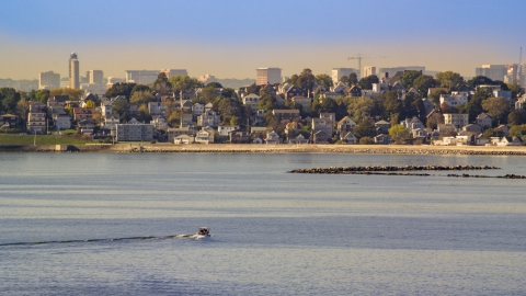 AX147_015.0000241 - Aerial stock photo of A fishing boat on Broad Sound near waterfront homes, Revere, Massachusetts