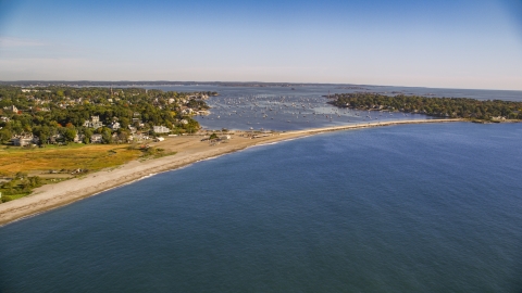 AX147_023.0000242 - Aerial stock photo of Marblehead Harbor and coastal community among trees, Marblehead, Massachusetts