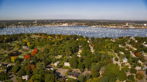 Coastal community in autumn near boat filled harbor, Salem, Massachusetts Aerial Stock Photos | AX147_033.0000000