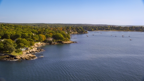 AX147_059.0000036 - Aerial stock photo of Oceanfront homes and fall foliage, Manchester-by-the-Sea, Massachusetts