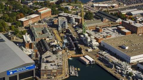 AX147_202.0000178 - Aerial stock photo of Submarine docked at Portsmouth Naval Shipyard, Kittery, Maine