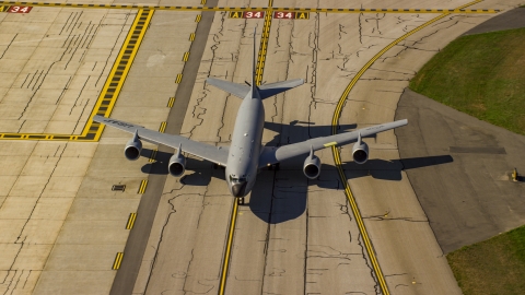 AX147_217.0000000 - Aerial stock photo of A military plane on runway, Portsmouth International Airport, New Hampshire