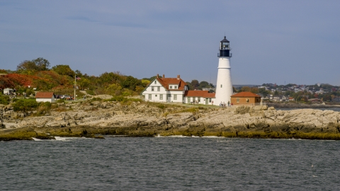 Portland Head Light by the rocky shore in autumn, Cape Elizabeth, Maine Aerial Stock Photos | AX147_310.0000000