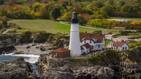 AX147_313.0000000 - Aerial stock photo of The Portland Head Light on the rocky coast in autumn, Cape Elizabeth, Maine