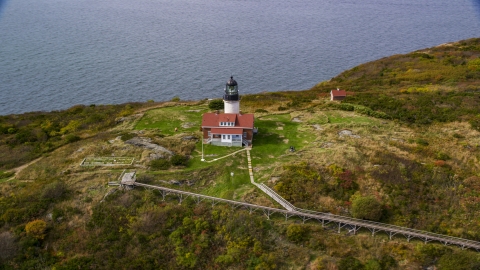 AX147_390.0000033 - Aerial stock photo of Seguin Light on Seguin Island with autumn foliage, Phippsburg, Maine