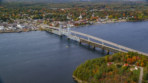 AX147_413.0000000 - Aerial stock photo of The Sagadohoc Bridge by small town, autumn, Bath, Maine