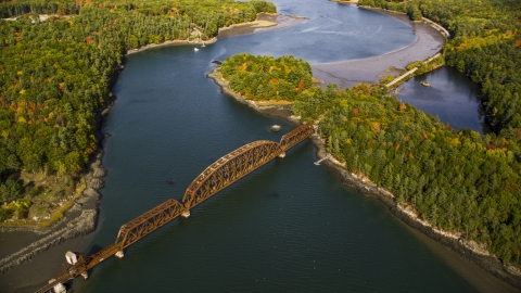 AX148_006.0000050 - Aerial stock photo of A small bridge spanning Sheepscot River, autumn, Newcastle, Maine