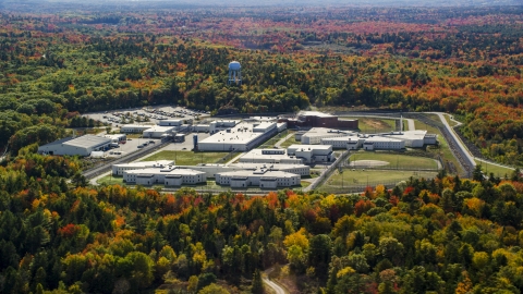 Maine State Prison surrounded by colorful forest, autumn, Warren, Maine Aerial Stock Photos | AX148_065.0000000