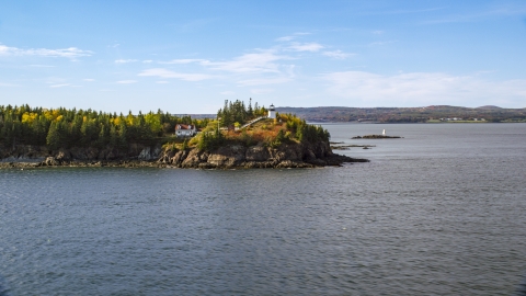 Owls Head Light and trees with partial fall foliage, autumn, Owls Head, Maine Aerial Stock Photos | AX148_082.0000261