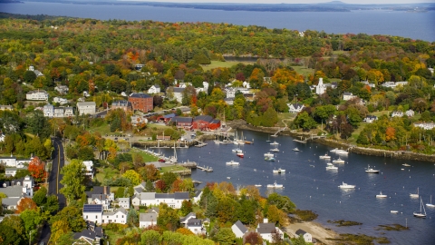 AX148_099.0000000 - Aerial stock photo of A small coastal town and Rockport Harbor in autumn, Rockport, Maine