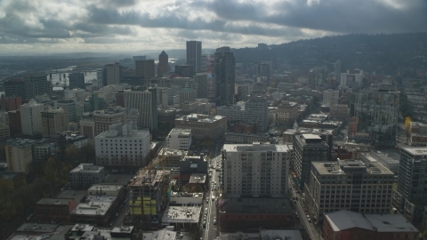 AX153_046.0000200F - Aerial stock photo of Downtown Portland city buildings on a cloudy day, Oregon