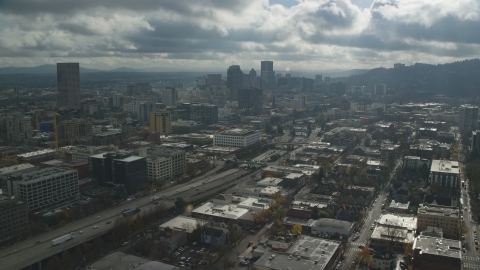 AX153_068.0000354F - Aerial stock photo of I-405 and Downtown Portland skyscrapers in Oregon